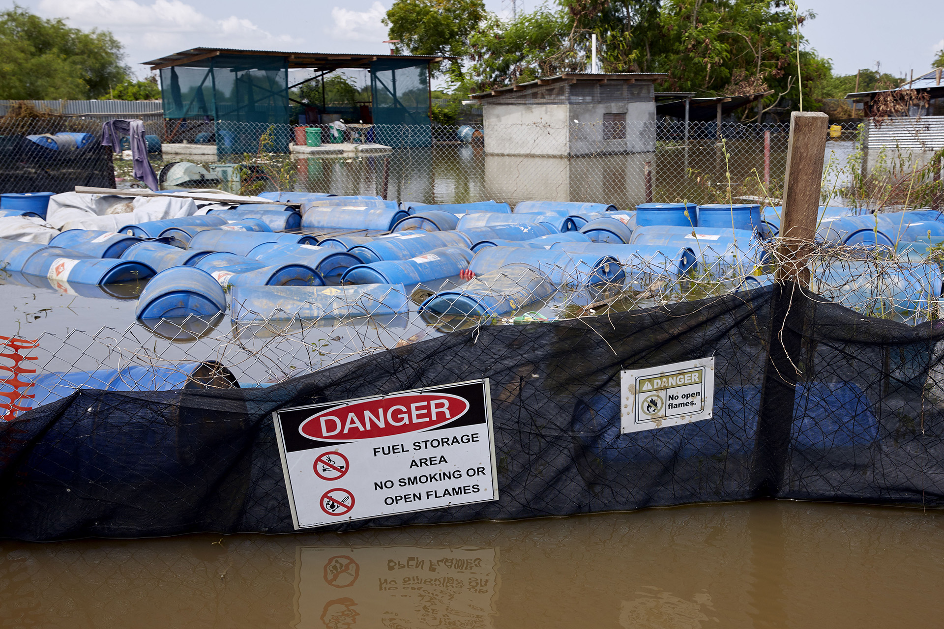 Empty fuel drums float around in the MSF healthcare facility.