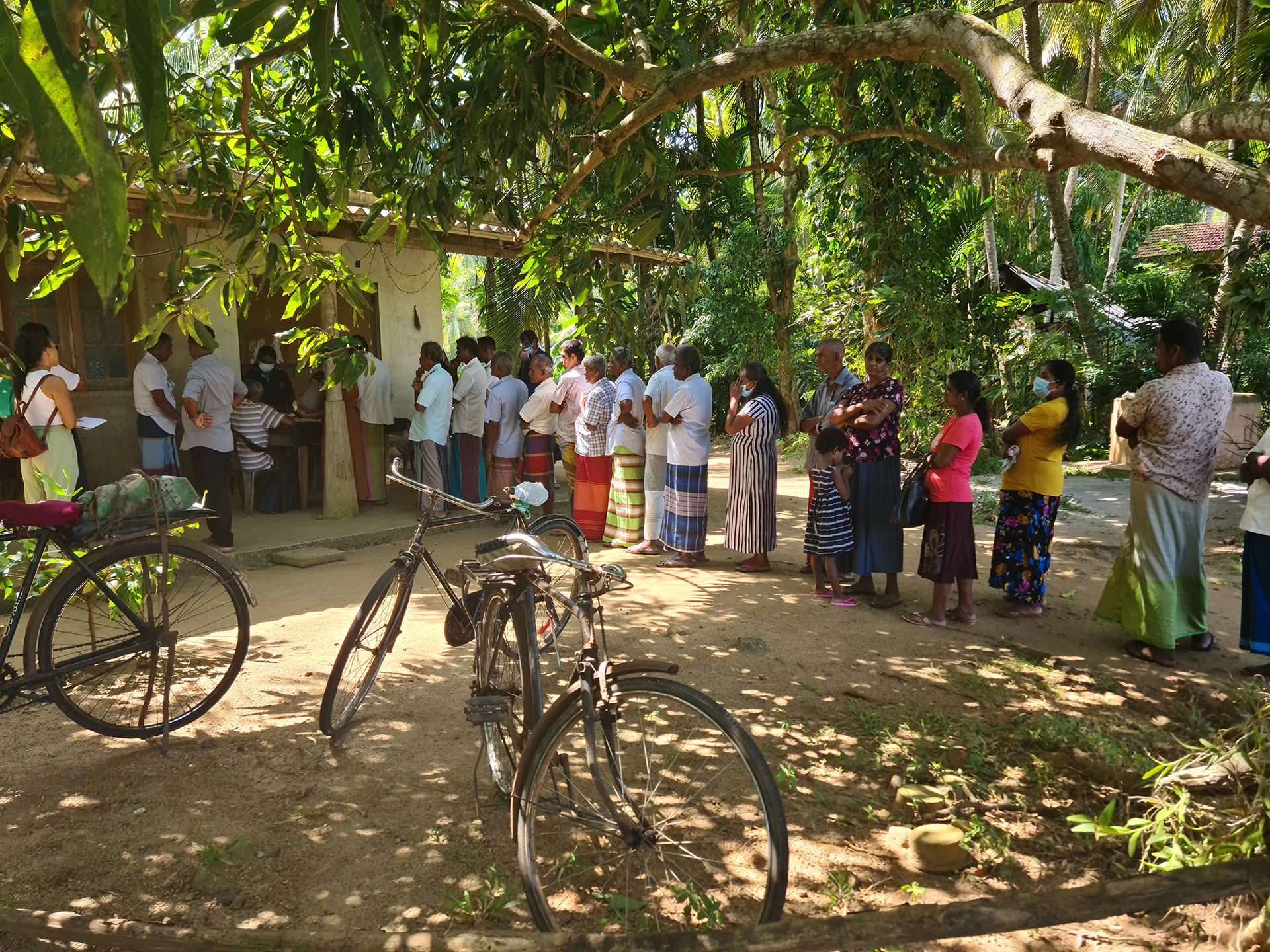 Farmers in Miella, Matara district, line up to give the state an estimate of how much chemical fertiliser they’ll require over the coming months.