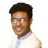Tanbirul Miraj Ripon is seen smiling at the camera. He wears glasses and white clothing.
