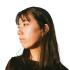 The profile of Kang-Chun Cheng. She looks to her right. She wears a dark blouse.