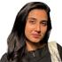 This is a headshot of Urwah Iftikhar. She is pictured smiling without showing teeth and looking at the camera. 