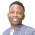 A headshot of Micheal Gumisiriza.