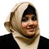 A headshot of Anam Zahra.