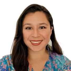 This is a headshot of Laura Valentina Cortés Sierra. She smiles at the camera. She wears a patterned turquoise blouse.