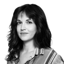 A headshot of Ylenia Gostoli. She is pictured smiling without showing teeth.