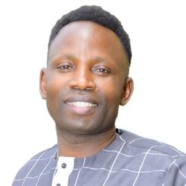 A headshot of Micheal Gumisiriza.