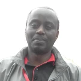 A headshot of Alex Wandeba.
