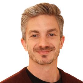 A headshot of Nicholas Pope.