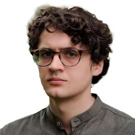 A headshot of Arsenii Alenichev.