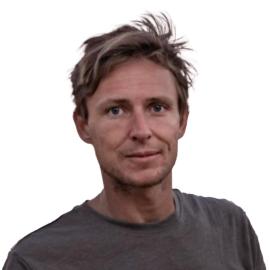 A headshot of Tommy Trenchard