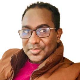 A headshot of Abdalle Ahmed Mumin.