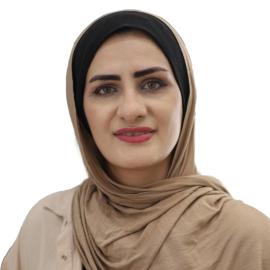 A headshot of Ansam Elkattaa.