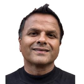 A headshot of Ben Ramalingam.