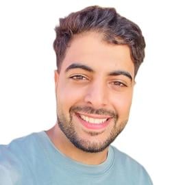 A headshot of Hassan Herzallah.