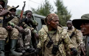Members of the M23 rebel group on a pick-up truck in Goma, shortly after they seized the city in late January.