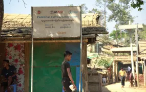 Rohingya walk along a pathway that was built with the help of USAID fund, at a refugee camp in Cox's Bazar, Bangladesh February 10, 2025.