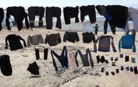 Various clothing pieces of laundry are hung up on a fence in al-Hol in January 2020. 