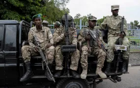 M23 rebels sit on a truck while escorting alleged captured FDLR members to Rwanda for repatriation, on 1 March 2025.