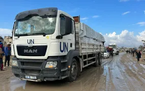 A photo of a UN aid truck on a dirt road in Gaza.