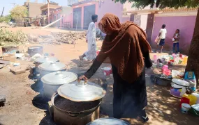 A Sudanese woman prepares food at “Takaya” the charity restaurant and a community kitchen, that help the needy Sudanese in Omdurman areas recently controlled by army during the conflict and war, during the holy month of Ramadan in the state of Khartoum Sudan March 14, 2025.