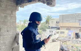 Rita Baroud wearing protective press gear out reporting in Deir al-Balah, Gaza.