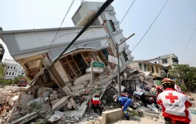 Members of the Chinese Red Cross International Emergency Response Team work at a collapsed residential building following the earthquake, in Mandalay, Myanmar March 31, 2025. 
