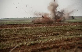 The photo shows a bomb being exploded by a landmine clearance team in Syria.
