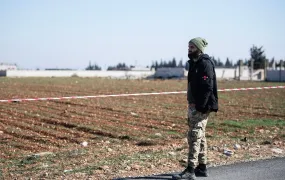 Mahmoud al-Mohammed looks on as a demining team from the White Helmets clears cluster munitions from his field in the Homs village of al-Jabrieh.