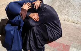 Palestinian women mourn a relative who was killed in an Israeli airstrike in Gaza City, on 7 May 2025.