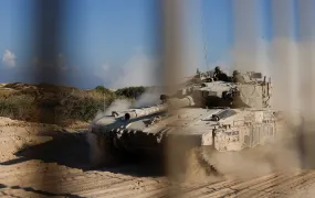 An Israeli tank manoeuvres before entering into the Gaza Strip, amid the ongoing conflict in Gaza between Israel and Hamas, at the Kerem Shalom crossing in southern Israel, November 11, 2024.