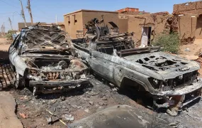 A photo of Destroyed combat vehicles in the Sharg Elnil area of Khartoum, Sudan.