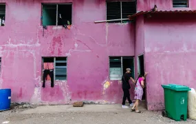 An abandoned house serves as a temporary shelter for stranded migrants in Miramar, some waiting over 10 days without money or resources as they hope for help to return home. Miramar, Colón Province, Panama. April 11, 2025.