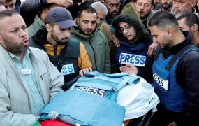 Mourners, including colleagues, attend the funeral of Ahmed al-Louh, a Palestinian video journalist for Al Jazeera TV who was killed in an Israeli strike in December 2024.
