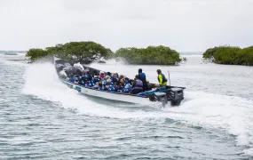 A boat departs from Miramar for Puerto Obaldía, the first stage of a three-day journey from Panama to Colombia that has become one of the main cross-continental routes for reverse flow migrants, on 11 April 2025.