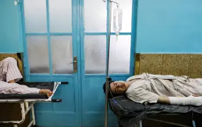 Injured men receive treatment in hospital after sustaining wounds from a blast at a wedding hall in Kabul, Afghanistan 18 August, 2019