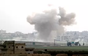 Smoke rises after an airstrike in Saraqeb in Idlib province, Syria, on 28 February 2020.