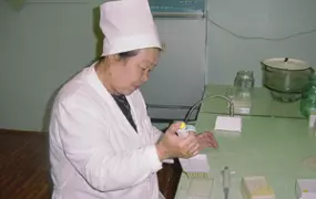 [Kyrgyzstan] A health worker in Osh checks blood for the HIV virus causing AIDS.