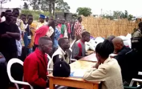 [DRC] Militiamen register at a disarmament site in Bunia, Ituri District.