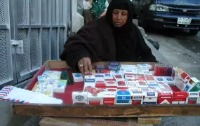 [Iraq] An Iraqi Shiite woman sells cigarettes in downtown Amman.