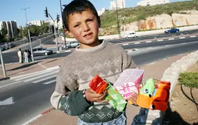 Children such as Younis, 8, do not need a permit to cross Israeli checkpoints.