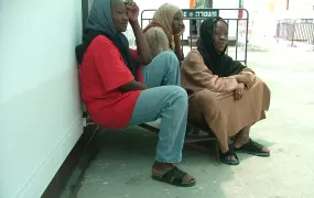 Three African female refugees inside a new camp set up by the Israeli authorities for illegal asylum seekers.