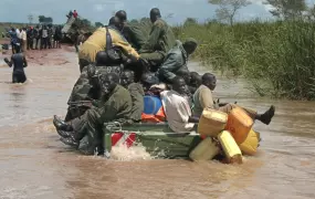 A four-wheel vehicle carrying soldiers and villagers crosses a flooded section of the Moroto-Kotido road in Karamoja region, northeastern, Uganda, September 2007.