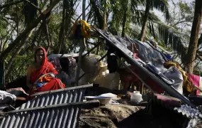 Marrium with her 13-day old child outside her home in Shoronkhola sub-district, Bagerhat district, Bangladesh, November 2007. Thousands of people lost their lives when Cyclone Sidr ravaged.