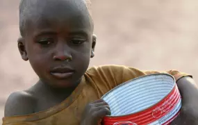 Talibe boy begging in Dakar.