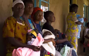 Mothers and their children await medical treatment, from a local dispensary in the village of Emukhangu in Lurambi division, of Kakamega district in western province. Malaria is the number one killer of children in these areas.