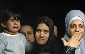 Palestinians gather during a funeral of two girls, Lama and Haya Hamdan, who were killed in Israeli air strikes in the northern Gaza Strip town of Beit Hanoun