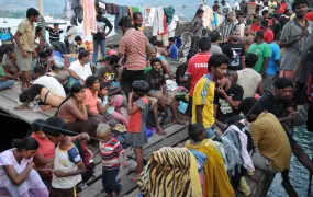 Some of a group of over 250 Sri Lankan asylum-seekers on their boat moored at Merak Port in the province of Banten, West Java. They were intercepted by the Indonesian navy in the Sunda Strait on their way to Australia