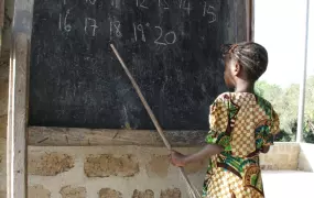 Girl counts and classmates repeat at a UNICEF-supported school in Makeni, Sierra Leone. February 2010