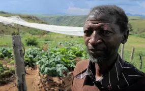 Alexis Mokhehle, a former mineworker, is feeding his family and earning a small income from his vegetable garden