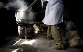 A cook on the job at a restaurant at the Nairobi City Park market, Kenya